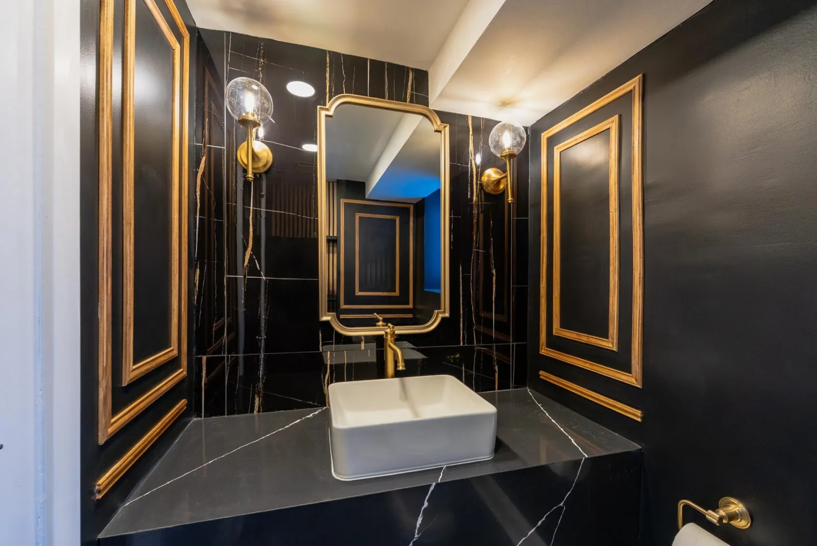 Black and gold powder room